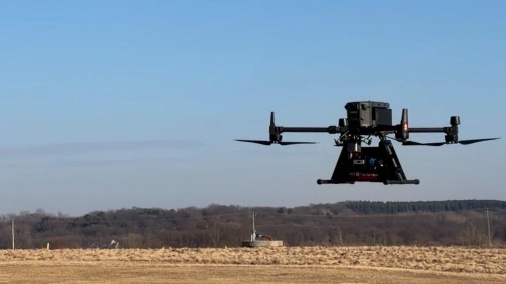 Drone hovering over field